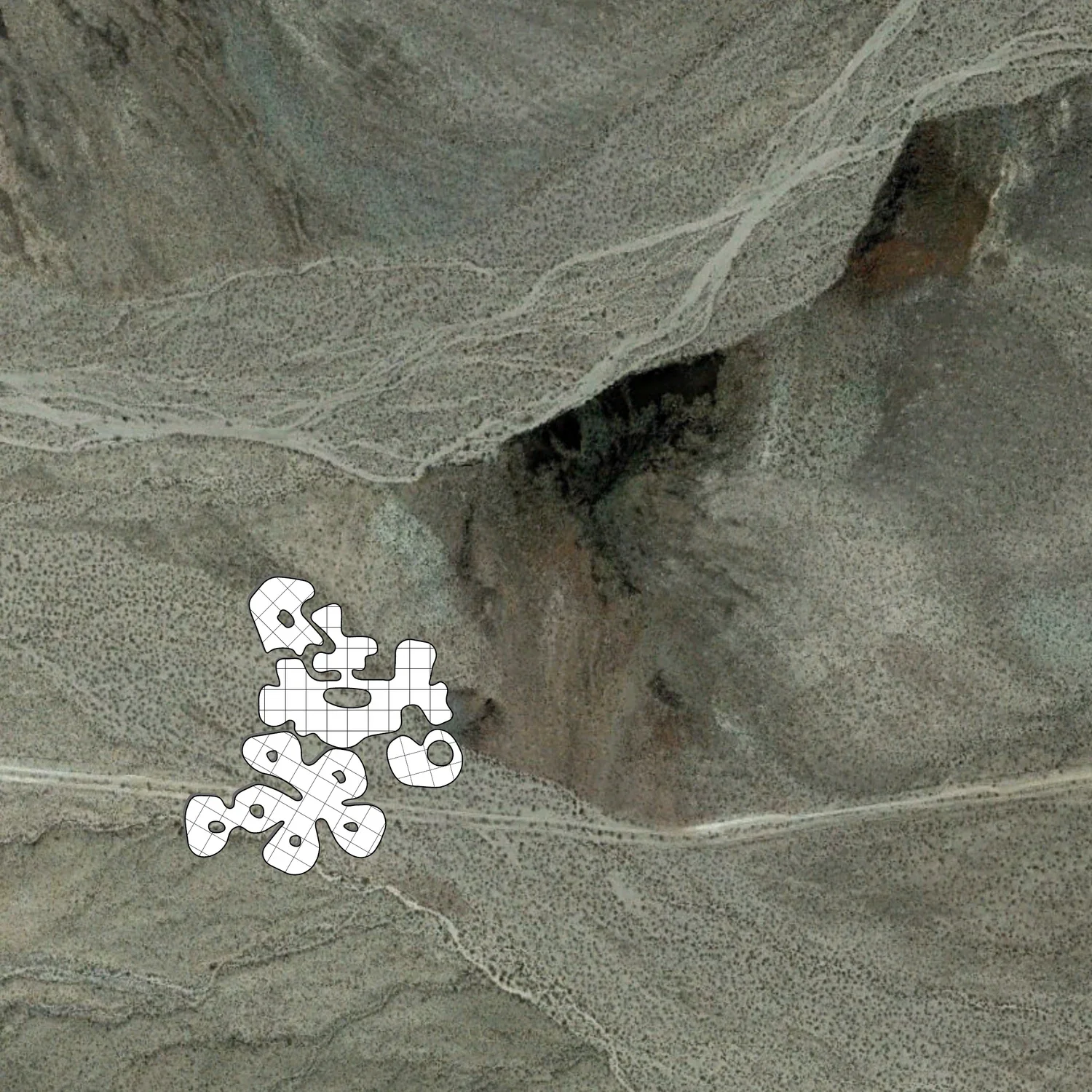 Aerial view of the campus scattered across the desert