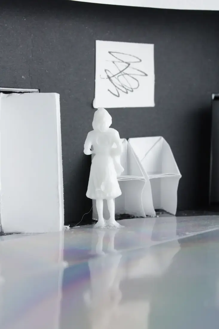 Physical model photographed with light streaming through the wells
