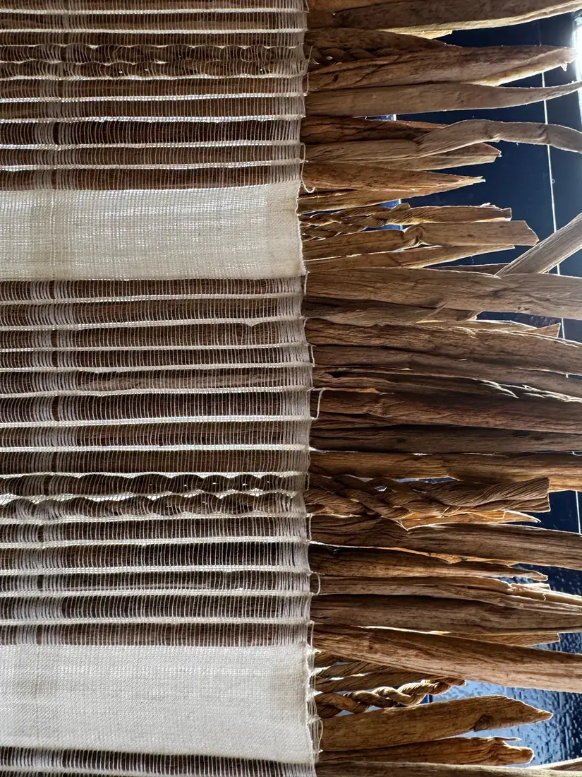 The woven textile of natural and conductive fibers